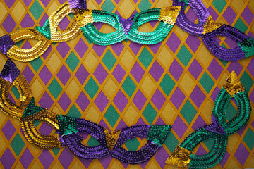 Frame of Mardi Gras Mask on diamond shaped background © vetre