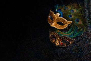 Luxury venetian mask on dark glitter background. Carnival masquerade fantasy mask