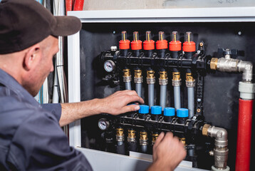 HVAC technician servicing home heating and cooling system