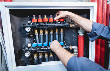 HVAC technician servicing home heating and cooling system