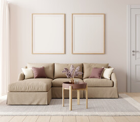 Living room interior with brown sofa, coffee table and two picture mock up on warm colored wall. 3D render. 3D illustration.