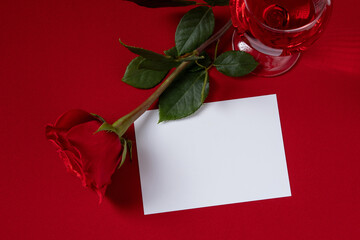 Valentine's Day blank message card with red rose and red wine. Romantic love message.