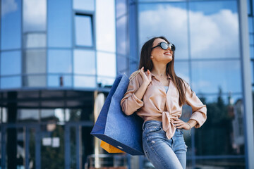 Young woman by the shopping center
