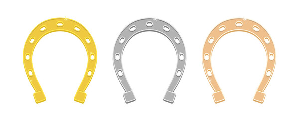 Set of horseshoes made of different metals. Gold, silver, copper horseshoe.