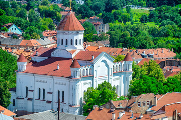 Aerial view of Vilnius city landmarks in the moddle of trees, Lithuania. - obrazy, fototapety, plakaty