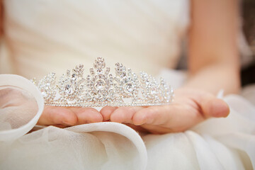 wedding tiara in the hands of the bride