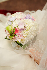 bride holding wedding bouquet