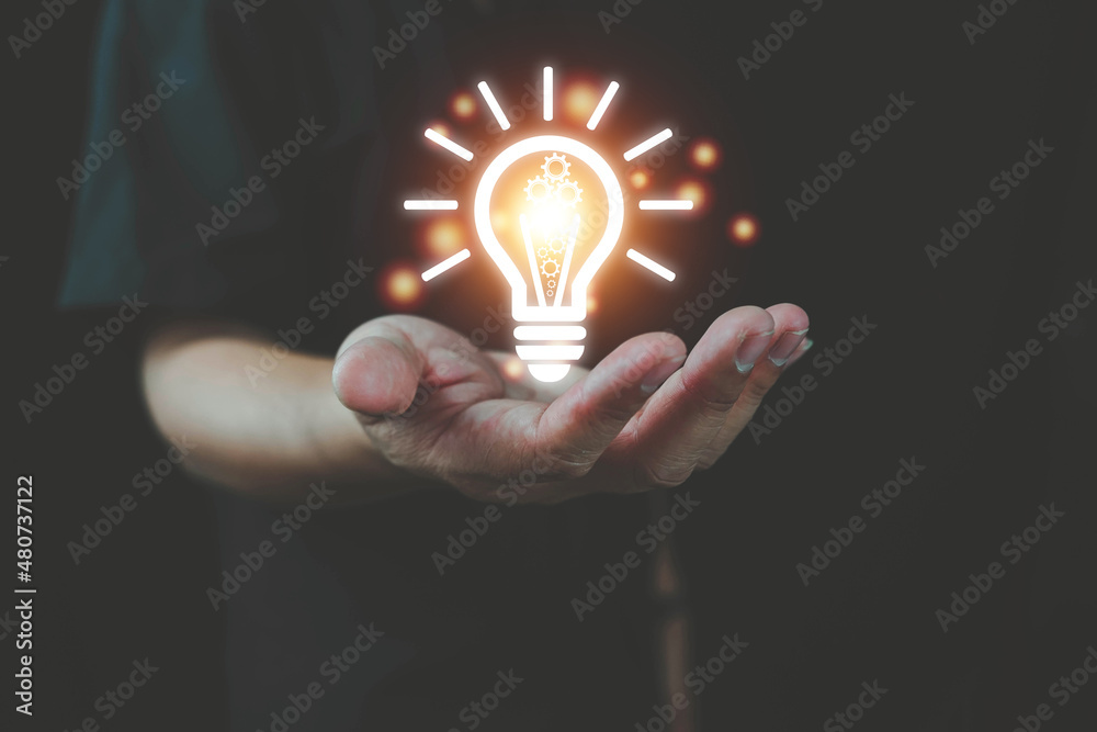 Wall mural light bulb with brain inside the hands of the businessman and point connecting network background. c