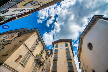 Fototapeta na wymiar Old buildings of Bergamo Alta, Italy. Skyward view.