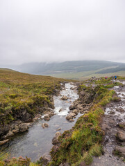 Fairy pools waterfalls shrouded in heavy mist at Glenbrittle, Isle of Skye, Scotland, Uk