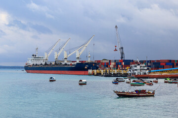 Port of Zanzibar with big ships, cranes and cargos near the quay in Stone Town, Zanzibar, Tanzania