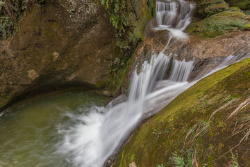 Silk effect on waterfalls in caves carved out of sandstone, Caglieron caves, Veneto, Italy