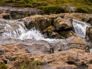 Obraz premium Fairy pools waterfalls after heavy rainfall, Glenbrittle, Isle of skye, Scotland, UK