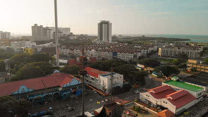 Malacca, Malaysia. Aerial view of city homes and skyline from drone on a clear sunny day