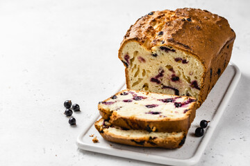 White chocolate vanilla black currant loaf cake. Copy space.