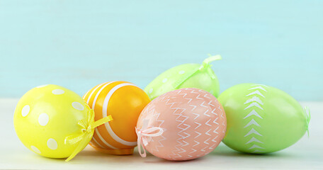 Easter painted eggs close-up on a light wooden table