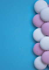 round candies on a blue background