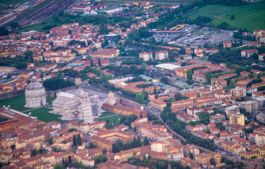 Fototapeta na wymiar Airplane view of Field of Miracles in Pisa. Leaning Tpwer and surrounding buildings in Tuscany.