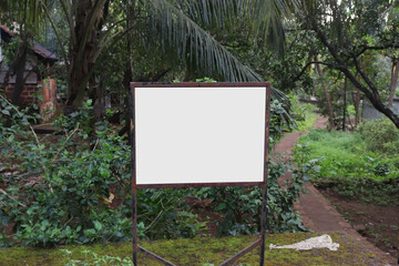 Fototapeta premium Blank Sign Board In The Green Park