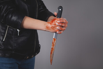 Caucasian killer bloody knife in hand. Crime concept. Bloody hands.