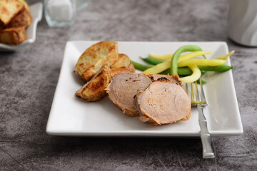 closeup roast pork with fork