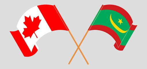 Crossed and waving flags of Canada and Mauritania