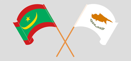 Crossed and waving flags of Mauritania and Cyprus