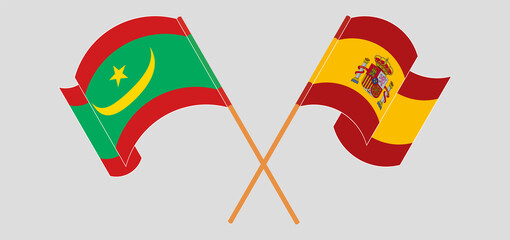 Crossed and waving flags of Spain and Mauritania