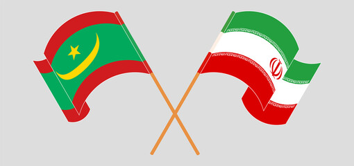 Crossed and waving flags of Mauritania and Iran