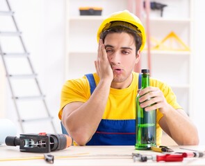 Drunk engineer working in the workshop