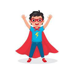 Cute little boy plays wearing superhero costumes standing raising hands greeting with smiling welcome 