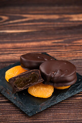 chocolate on pile of apricots