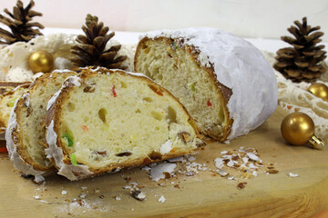 Traditional German Christmas pastries on a festive background. Homemade Christmas chopped stollen...