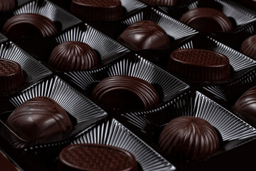 Box with chocolate candies' rows