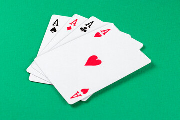 Playing cards on green background.