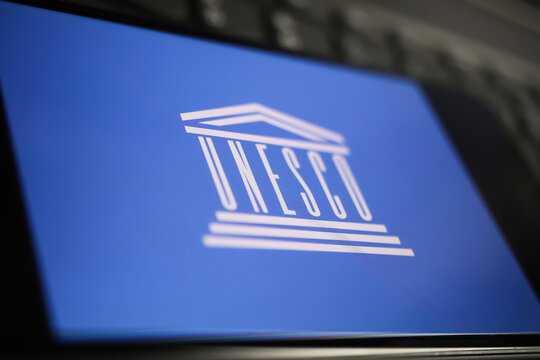 Viersen, Germany - January 9. 2022: Closeup of mobile phone with logo lettering of unesco on computer keyboard