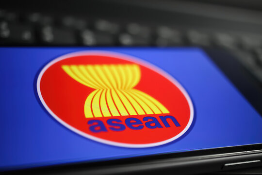 Viersen, Germany - January 9. 2022: Closeup of mobile phone with logo lettering of asean on computer keyboard