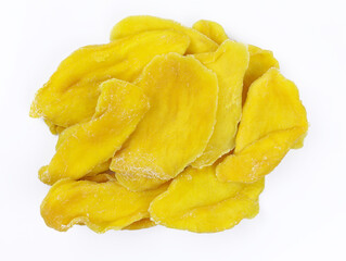 Dried pieces of mango on a white background. Sugar-free sliced dried mango top view. Delicious and healthy dried fruits.