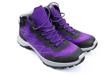 Mens winter boots with laces on a white background. Purple shoes made of rubber and suede close-up. Bright modern stylish footwear for the winter period.