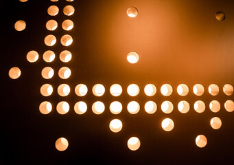 Metal sheet with lights braille dots background.