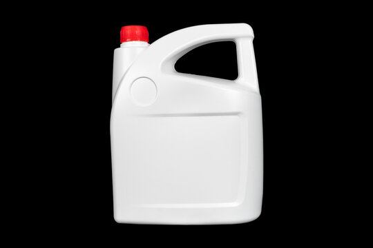 New white plastic oil canister isolated on black background.  Storage tank. Canister for gasoline, diesel and gas. White plastic canister for technical liquids isolated.