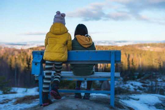 Enjoying the view from the Blue Bench of the Majerskogen Forest at Toten, Norway, in winter.