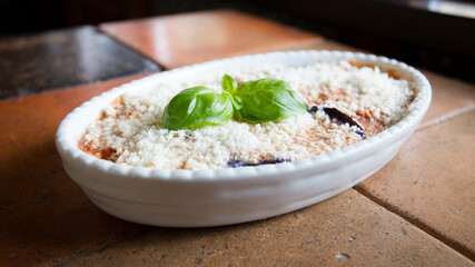 Parmigiana with eggplant and melted cheese. Italian recipe.