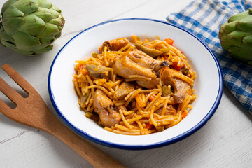 Noodles with noodles, artichokes and other vegetables. Traditional north spain dish.