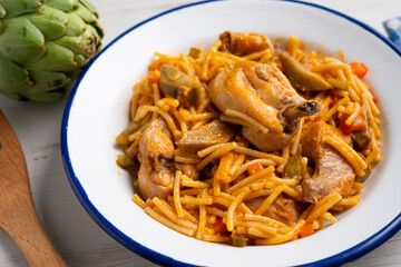 Noodles with noodles, artichokes and other vegetables. Traditional north spain dish.