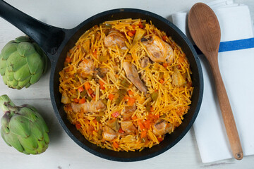 Noodles with noodles, artichokes and other vegetables. Traditional north spain dish.