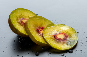 Red kiwi fruit berry slices macro natural light on breakfast wood healthy diet