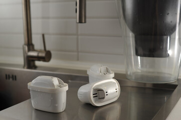 white filter for purifying drinking water in the kitchen