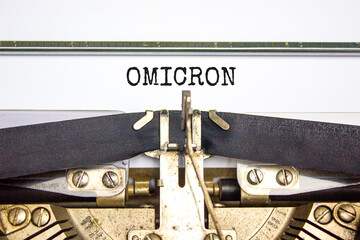 Covid-19 corona and omicron symbol. The concept word Omicron typed on retro typewriter. Beautiful...