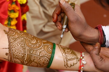 henna tattoo on hands of the bride